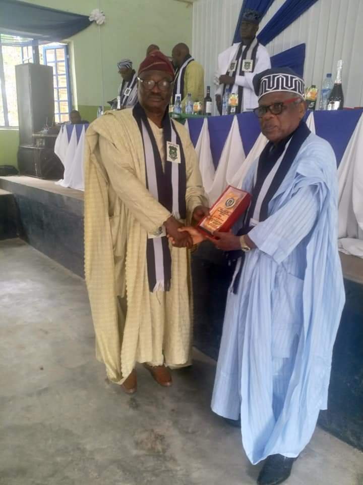 Late Prof Ladapo Olawoye, National President 2004 - 2009 receiving an award of Great Imadean from Mr Yinka Akinola at the 2019 AGM